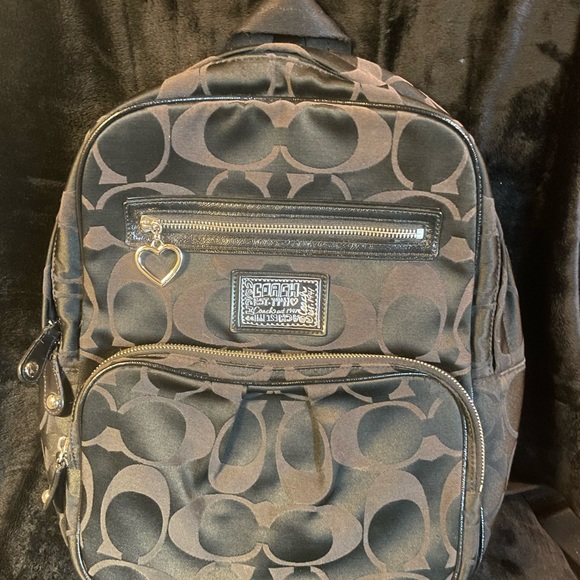 backpack women coach Mini Court in Signature Canvas Club de Mode Refined pebble leather Inside zip cell phone and multifunction pockets Laptop compartment with zip closure Zip closure recycled polyester lining Top handle with 2 drop Outside zip pockets Adjustable shoulder straps Fits a 12 (zip compartment) or 13 (main compartment) laptop 10 3/4 (L) x 14 (H) x 5 1/4 (W) Style No. COACH LV | Court Backpack